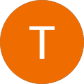 Orangefarbene runde Form mit weißem Buchstaben T.